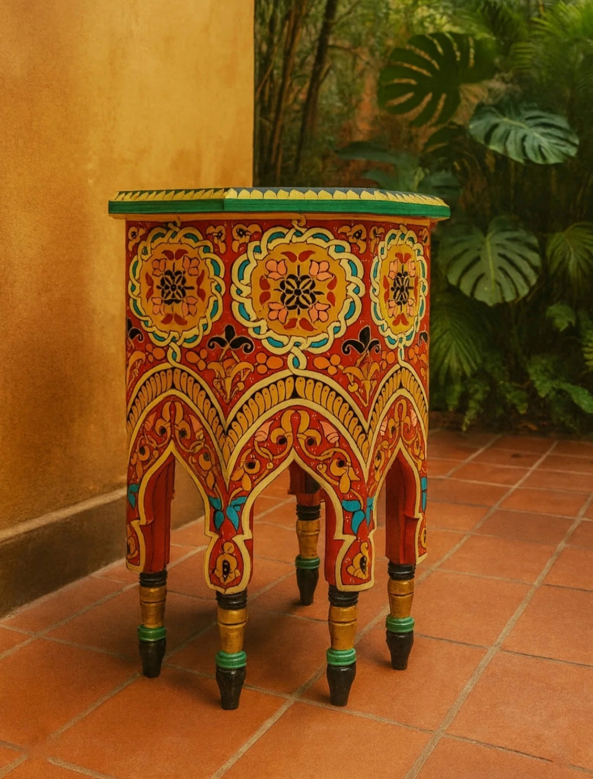 hand-printed wooden table with bold Moorish patterns 