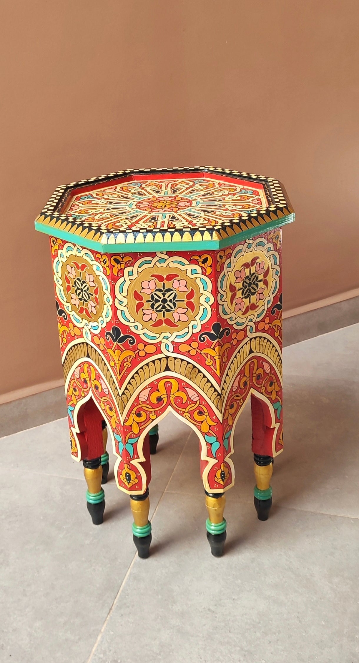 Moroccan hand-printed wooden table with bold Moorish patterns 