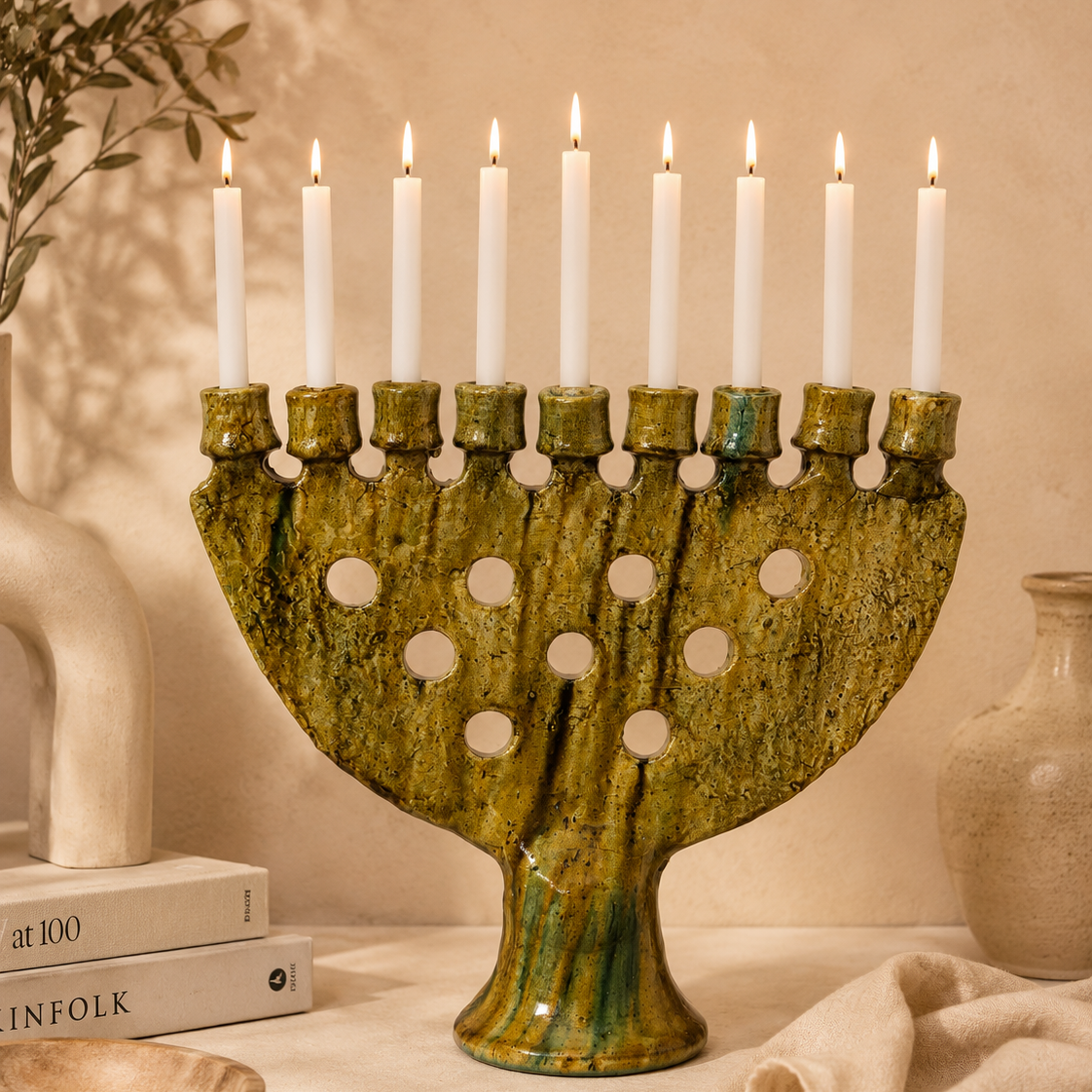 Authentic Moroccan Tamegroute pottery candle holder on beige interior background