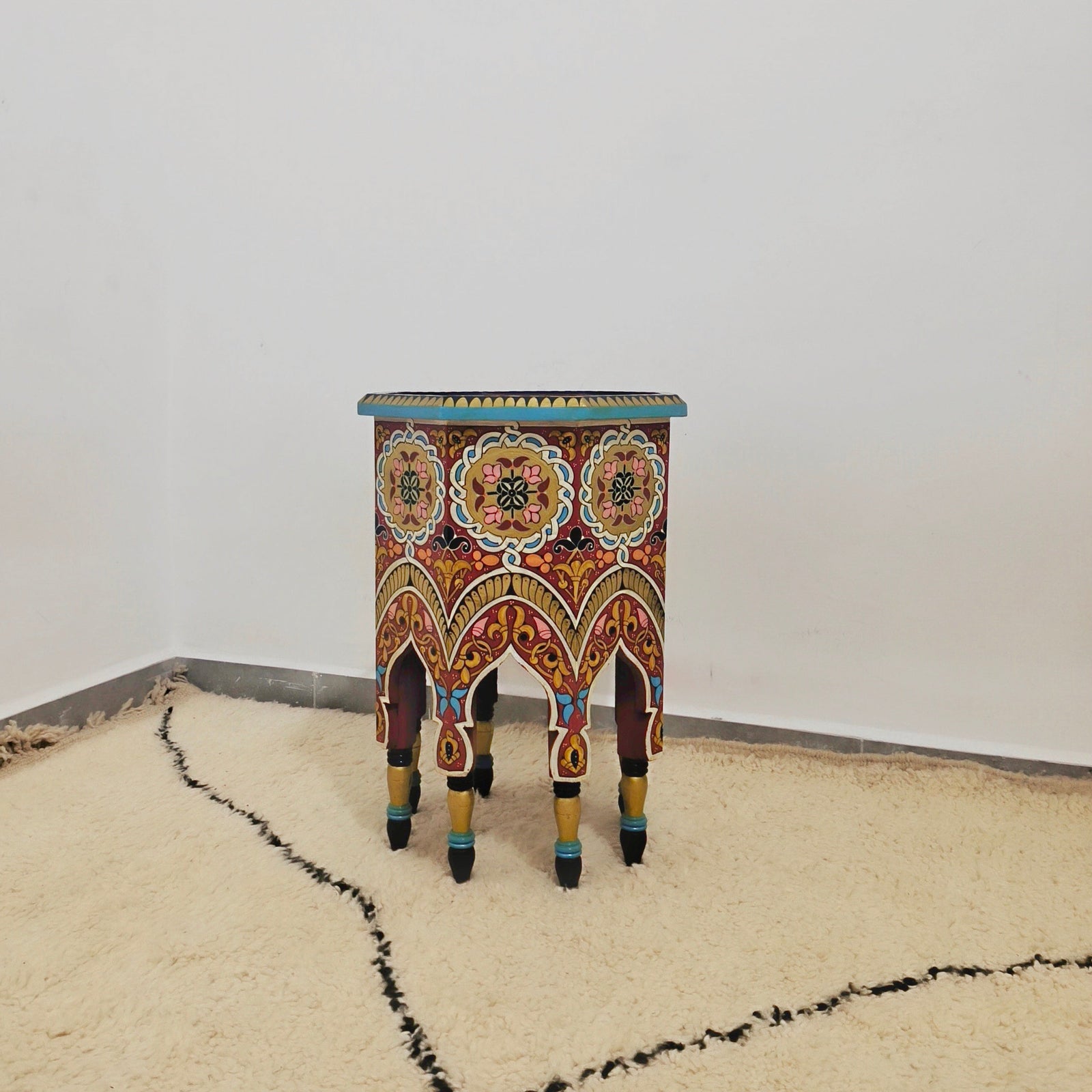 Moroccan hand-printed wooden table with bold Moorish patterns 