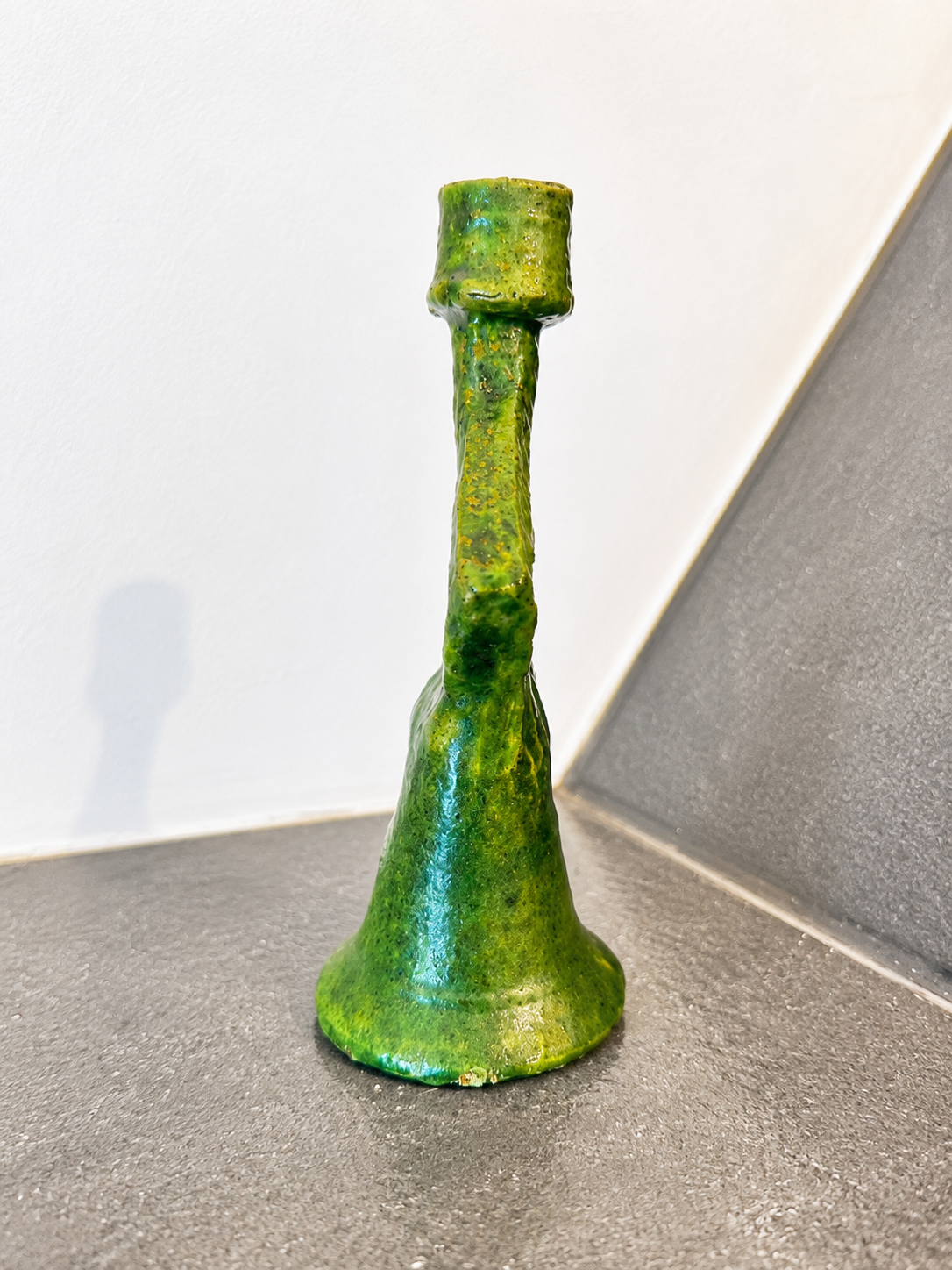 Side profile of a handmade Moroccan ceramic candle holder with glossy green glaze and handcrafted finish.