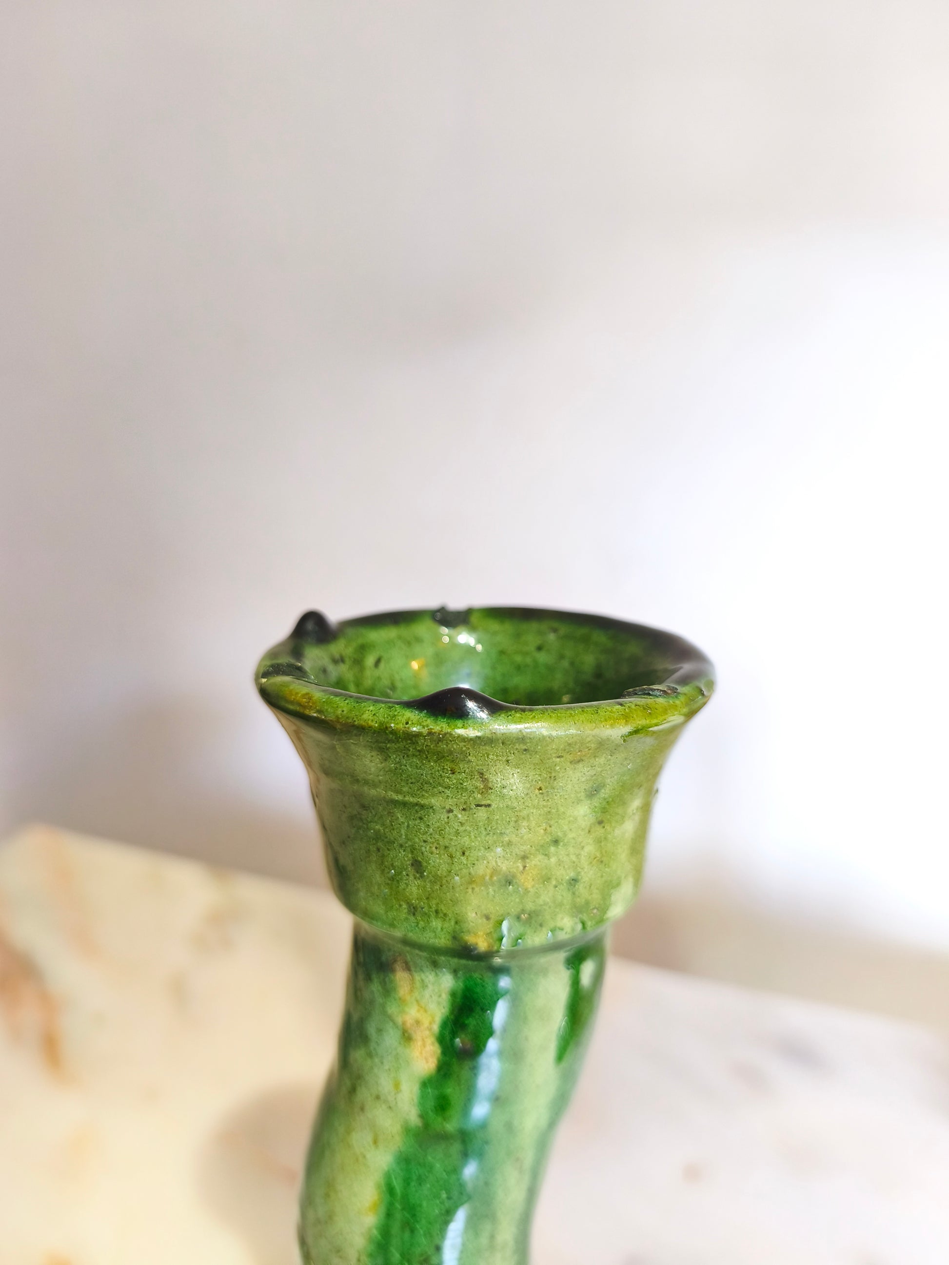 Handcrafted Moroccan pottery candle holder with green glaze and textured finish