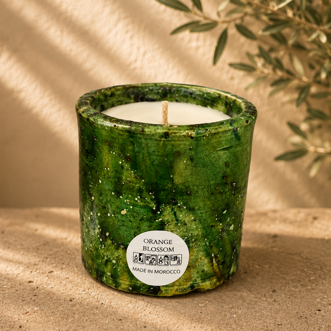 Handmade green Tamegroute ceramic candle with orange blossom fragrance in an authentic Moroccan pottery vessel.