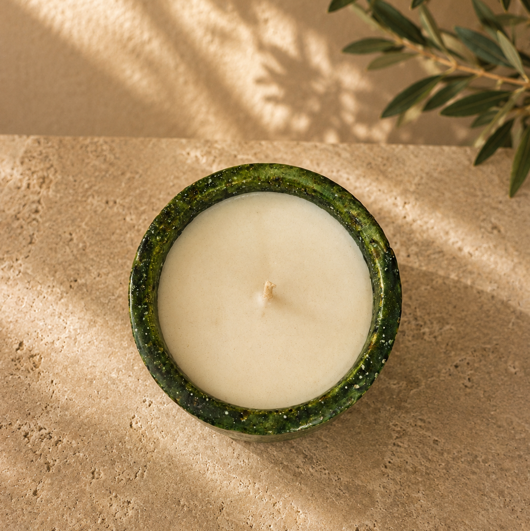 Close-up of a handmade Moroccan Tamegroute ceramic candle with orange blossom scented soy wax
